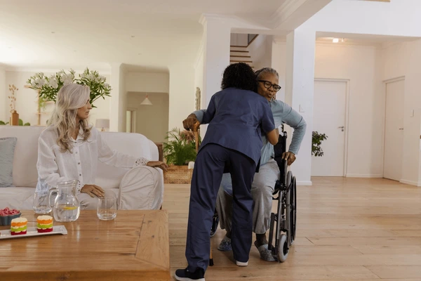 Caregiver assisting senior with personal hygiene